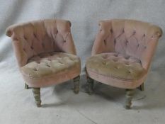 A pair of distressed painted bedroom tub chairs in buttoned upholstery on turned tapering