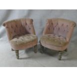 A pair of distressed painted bedroom tub chairs in buttoned upholstery on turned tapering