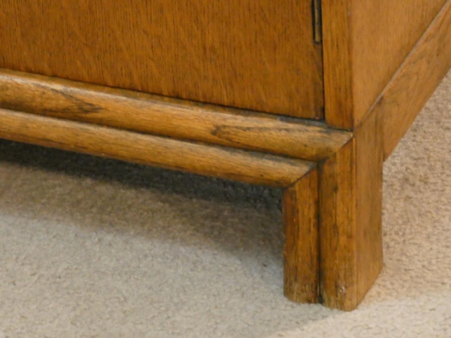 A mid century oak Art Deco style tallboy cabinet with two drawers above panel doors fitted with - Image 7 of 7