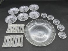 A collection of antique cut crystal items. Including a set of fourteen star cut knife rests, a