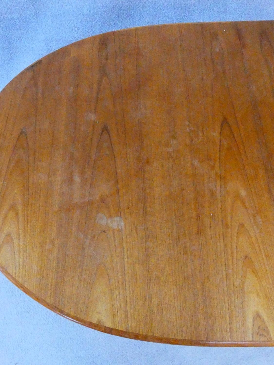 A 1960's vintage teak extending dining table on trestle style supports with extra leaf. H.72 L.167 - Image 7 of 9