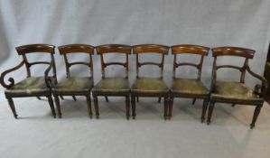 A set of six mid 19th century mahogany bar back dining chairs with leather stuffover seats on
