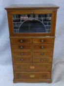 An Edwardian mahogany and satinwood with ebony inlaid specimen cabinet with leaded glass fall