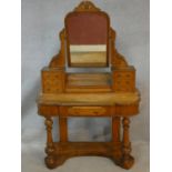 A Victorian satin birch duchess style dressing table with swing mirror and an arrangement of drawers