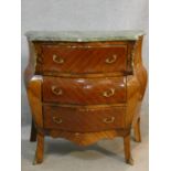 A French bombe style kingwood and inlaid commode with marble top and ormolu mounts on cabriole