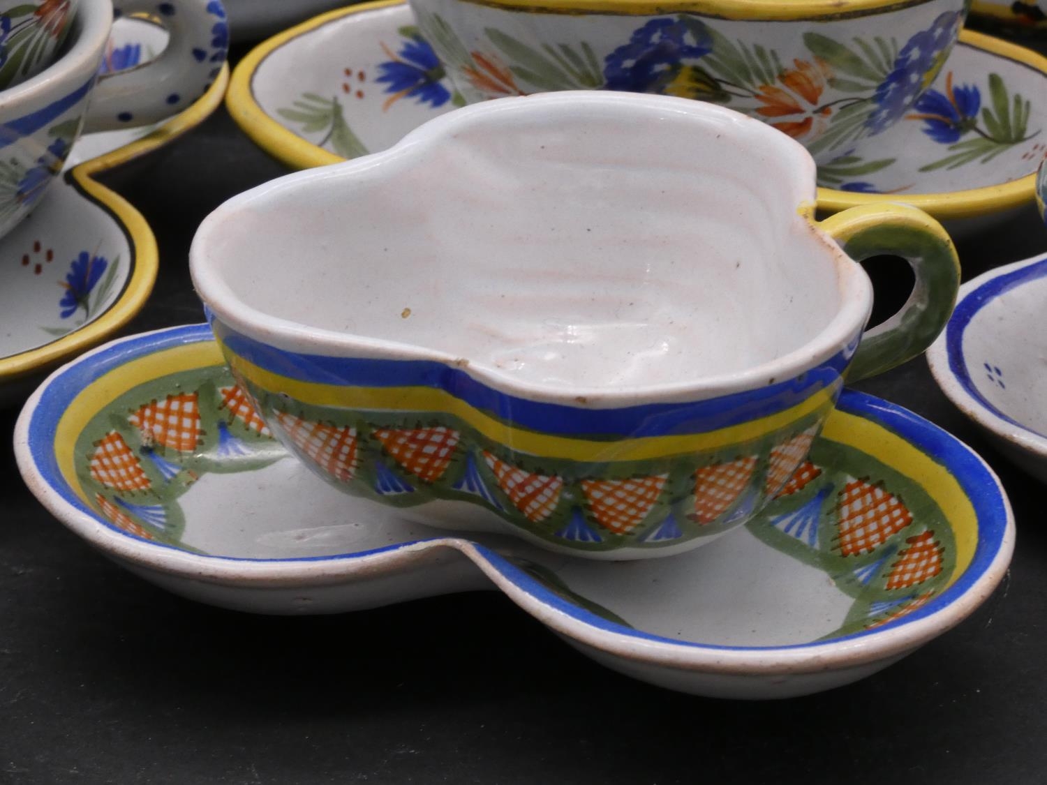 A large collection of antique Adolphe Porquier Quimper hand painted pottery dinner ware. Decorated - Image 3 of 10