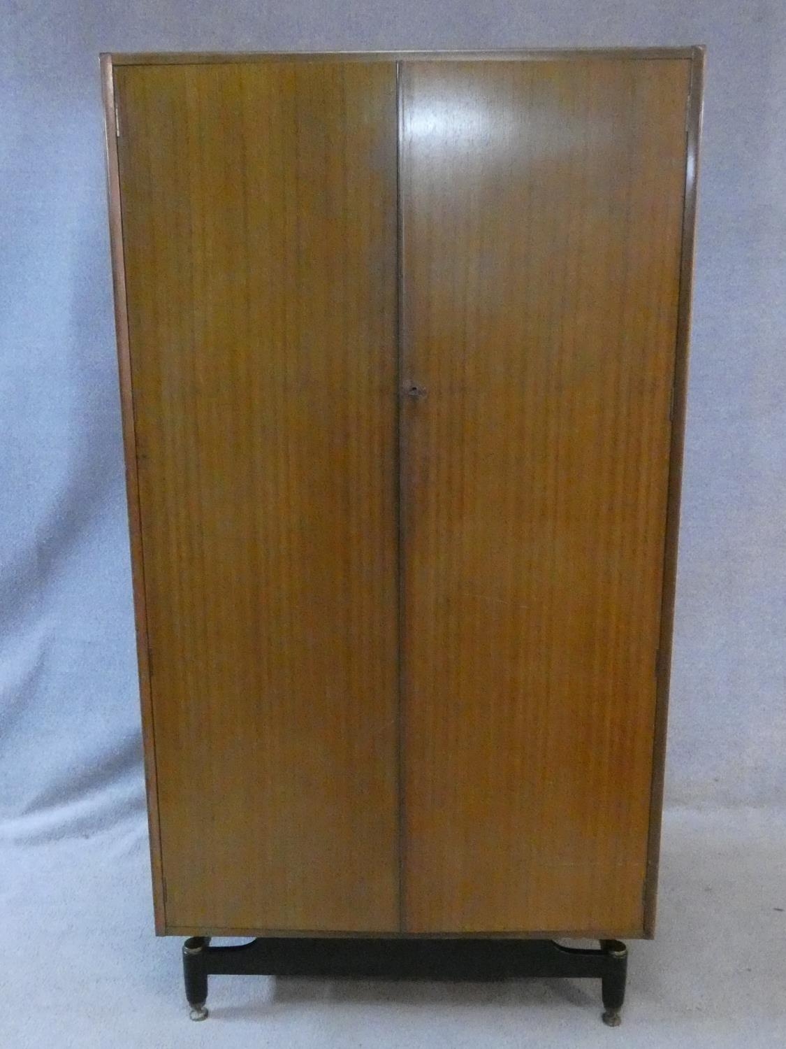 A mid century vintage teak G-Plan fitted compactum wardrobe on ebonised feet with Ebenezer Gomme - Image 8 of 15