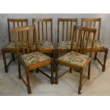 A set of six early 20th century antique style oak dining chairs with drop in seats on turned