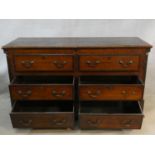 A Georgian oak and mahogany crossbanded mule chest with hinged lid revealing shallow compartment