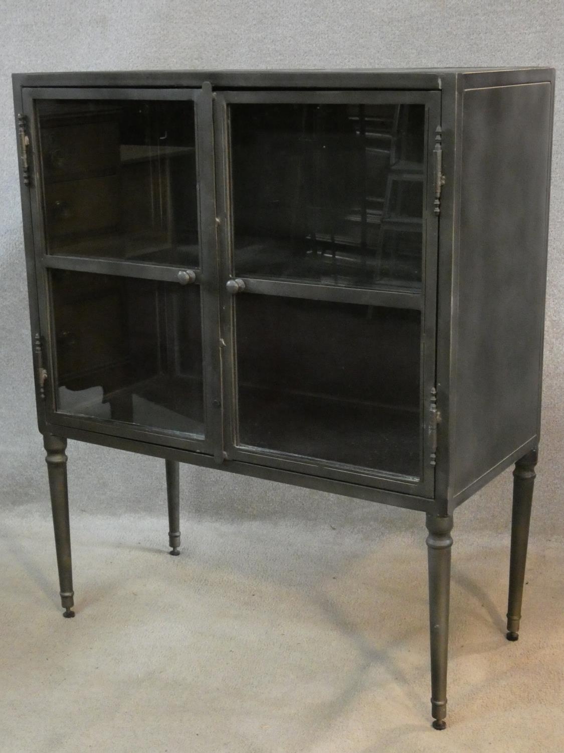 A contemporary vintage industrial style metal display cabinet or bookcase on tapering supports. H. - Image 2 of 5