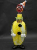 A vintage Murano glass decanter modelled as a clown with stopper as the head wearing a pierrot