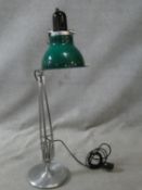 A vintage anglepoise lamp by Anglepoise with green perspex shade and makers label to brushed