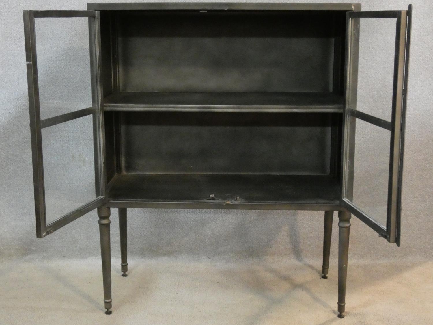 A contemporary vintage industrial style metal display cabinet or bookcase on tapering supports. H. - Image 3 of 5