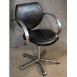 A vintage REM brushed aluminium desk chair in black leather upholstery. H.83cm