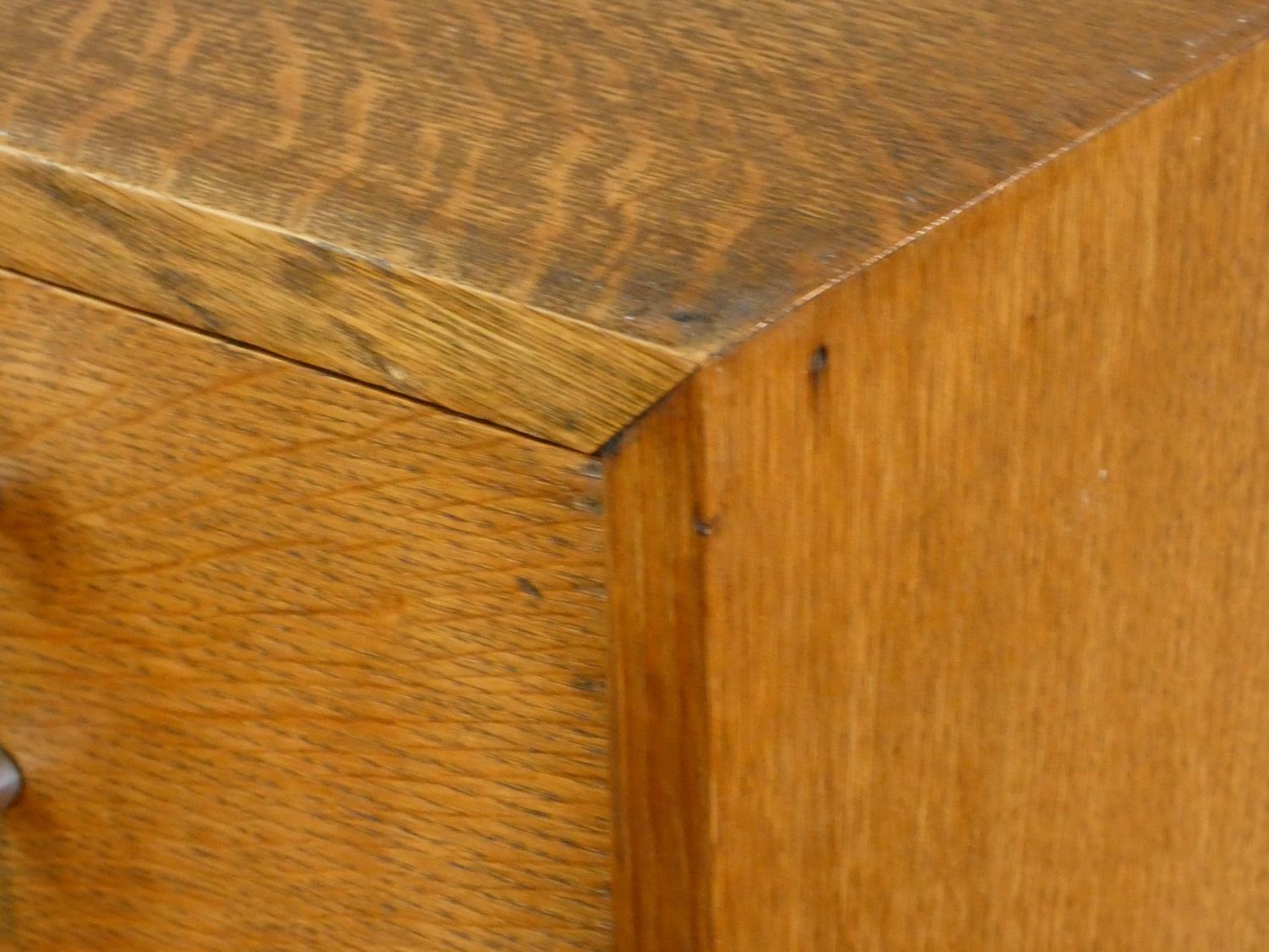 A mid century oak Art Deco style tallboy cabinet with two drawers above panel doors fitted with - Image 4 of 7