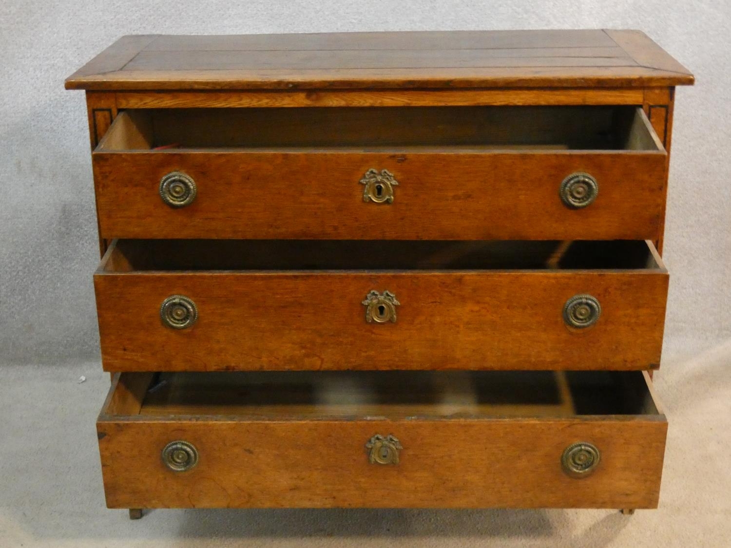 A 19th century French Provincial oak commode chest of three long drawers on square tapering - Image 3 of 8