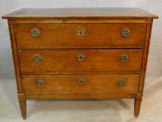 A 19th century French Provincial oak commode chest of three long drawers on square tapering