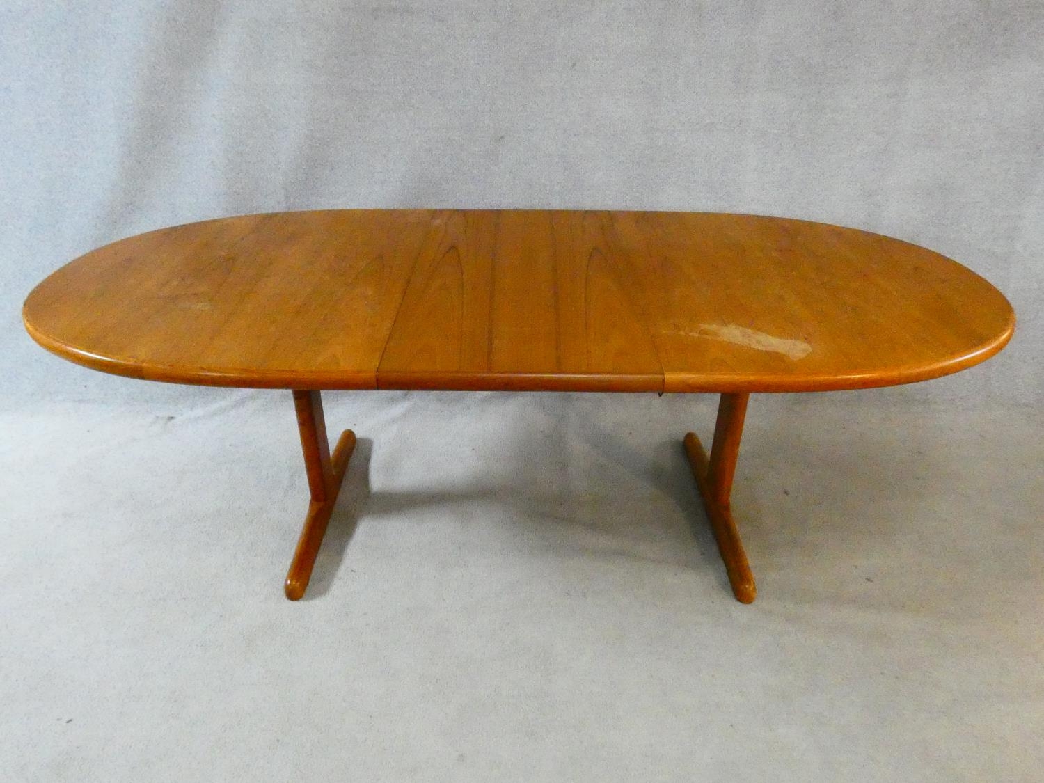 A 1960's vintage teak extending dining table on trestle style supports with extra leaf. H.72 L.167 - Image 2 of 9