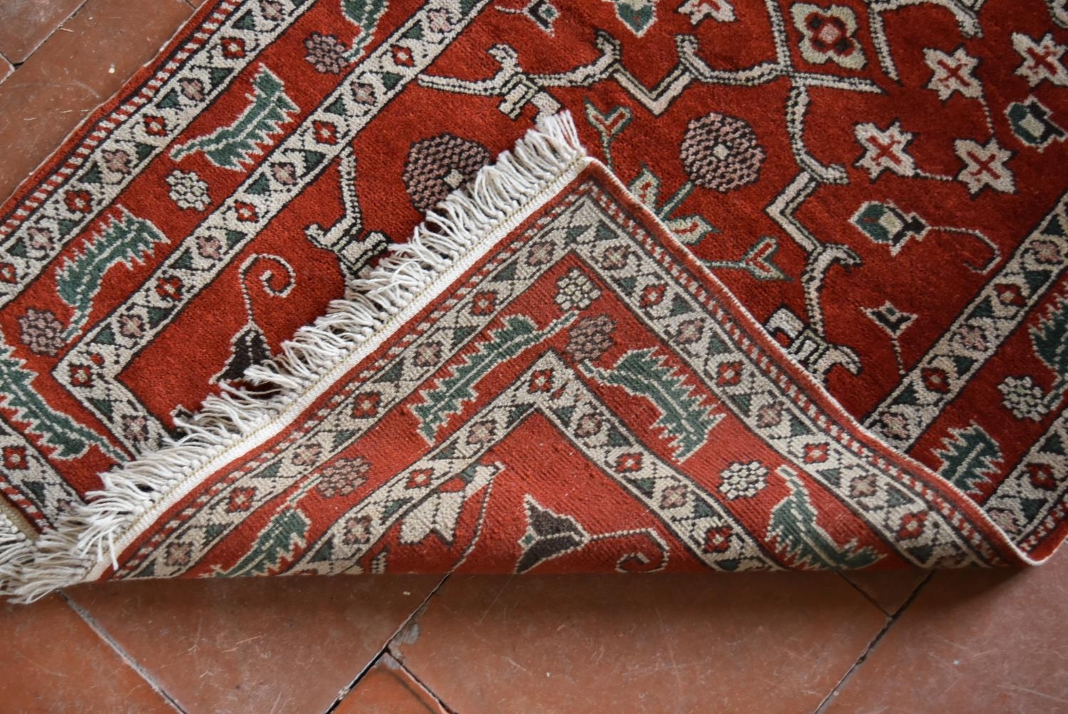 A Moughal style runner with repeating scrolling trellis central design within a border of serrated - Image 4 of 5