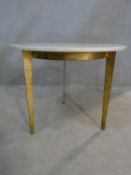 A marble topped occasional table on gilt metal tripod base. H.45.5 L.56 W.56cm