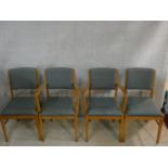 A set of four Gordon Russell beech framed dining chairs stamped Russell of Broadway to include two