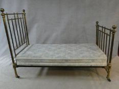A Victorian brass bedstead made for James Shoolbred, to take a 3 ft mattress.