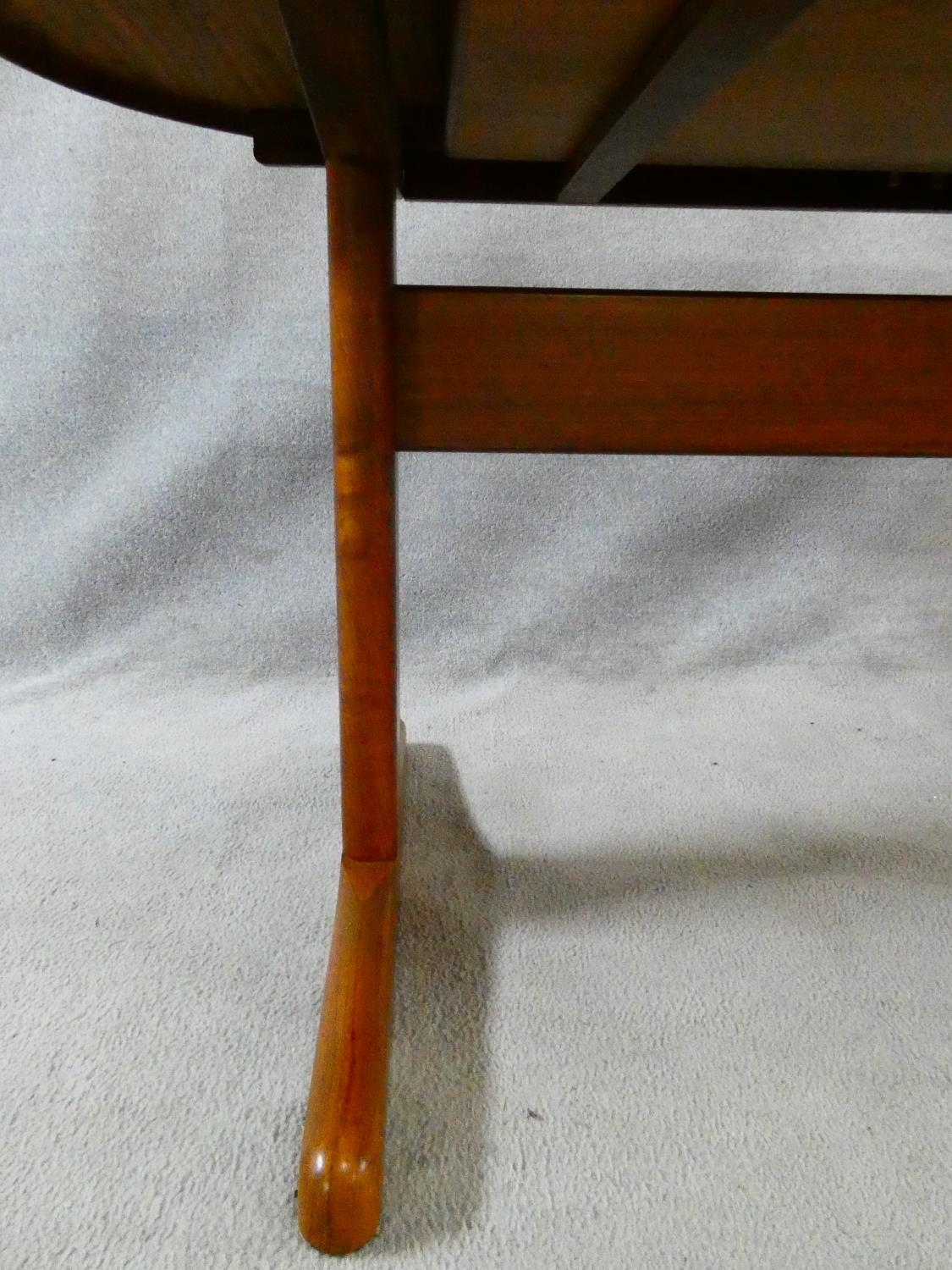 A 1960's vintage teak extending dining table on trestle style supports with extra leaf. H.72 L.167 - Image 8 of 9