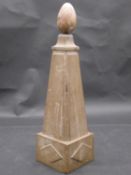 A carved marble obelisk with removeable ovoid spherical finial. H.44cm