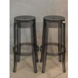 A pair of high stools stamped Charles Ghost by Kartell with Starck. tH.76cm