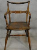 A 19th century beech framed armchair with moulded elm seat on turned stretchered supports. H.87cm