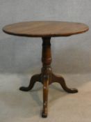 A Georgian elm occasional table on tripod cabriole base. H.65 D.71cm