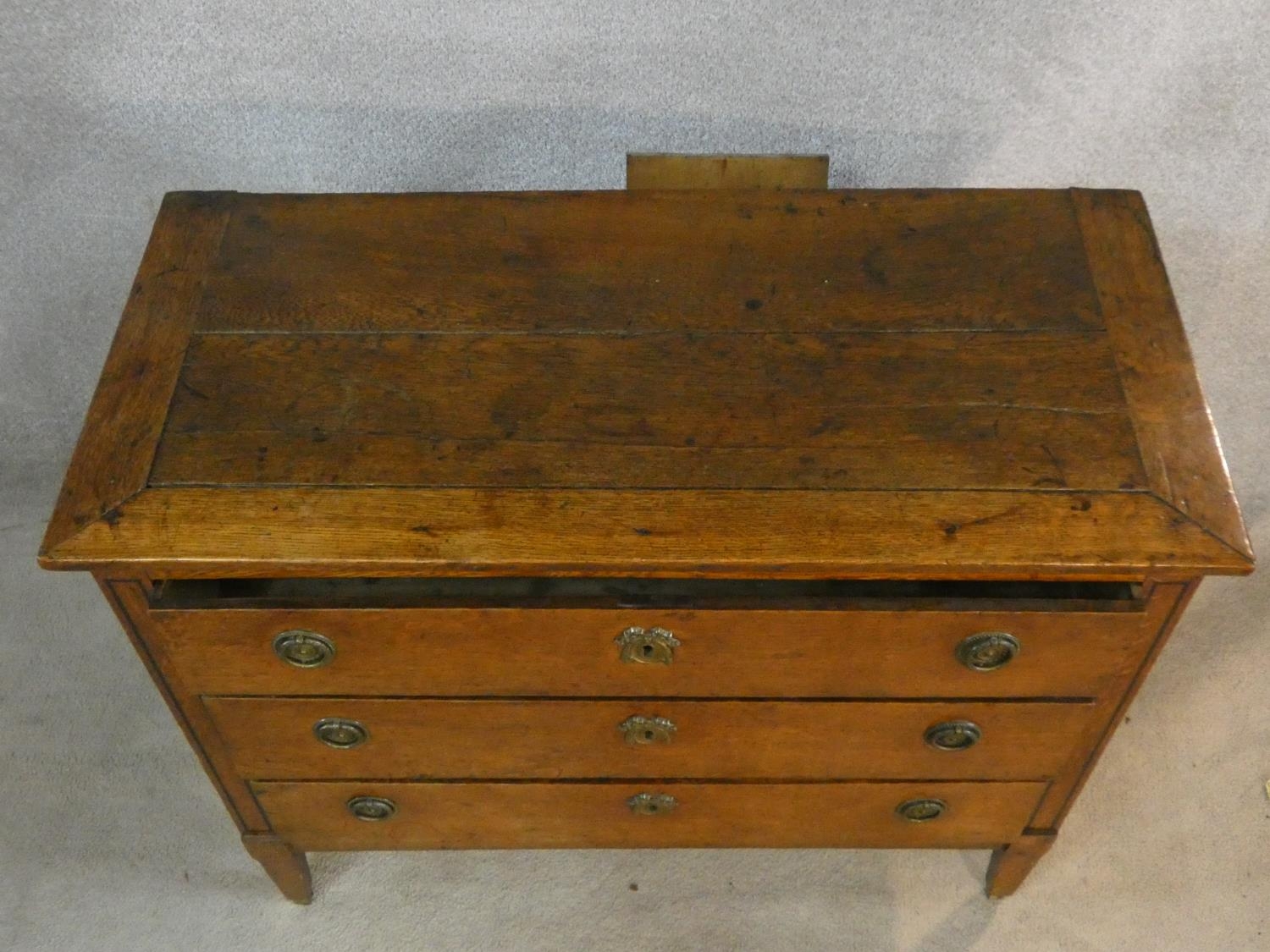 A 19th century French Provincial oak commode chest of three long drawers on square tapering - Image 4 of 8
