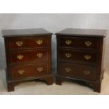 A pair of Georgian style mahogany and crossbanded three drawer bedside cabinets. H.71 W.60 D.50cm