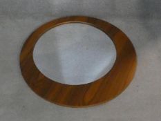 A contemporary wall mirror with off set circular plate. D.75cm