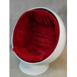 After Eero Aarnio, a vintage white polyester Ball Chair on swivel metal base with red velour