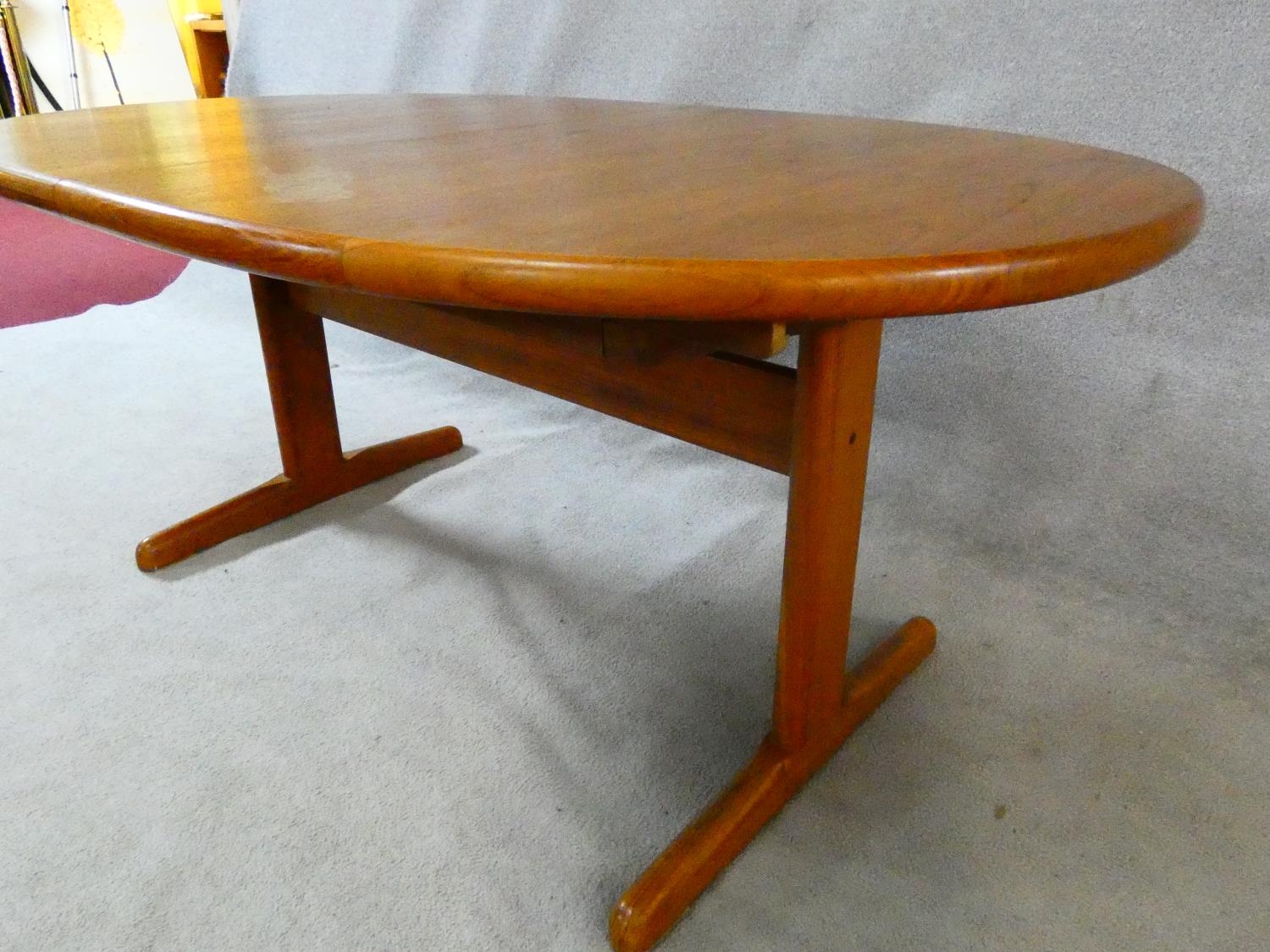 A 1960's vintage teak extending dining table on trestle style supports with extra leaf. H.72 L.167 - Image 4 of 9