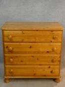 A Victorian style pine chest of four long drawers. H.85 W.87 D.44cm