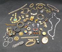 A large collection of vintage and costume jewellery. Including brooches, bracelets, necklaces, rings