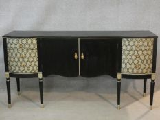 A 1960's vintage Formica laminate sideboard with cupboard doors flanked by lattice design drawers.