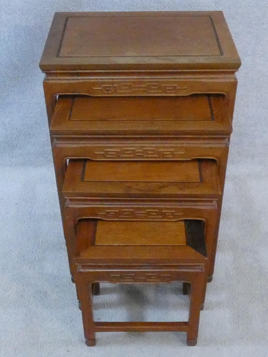 A nest of four Chinese hardwood graduating occasional tables with carved frieze on shaped - Image 2 of 11