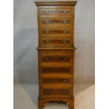 A dwarf Georgian style chest on chest with burr walnut quarter veneered and crossbanded top above