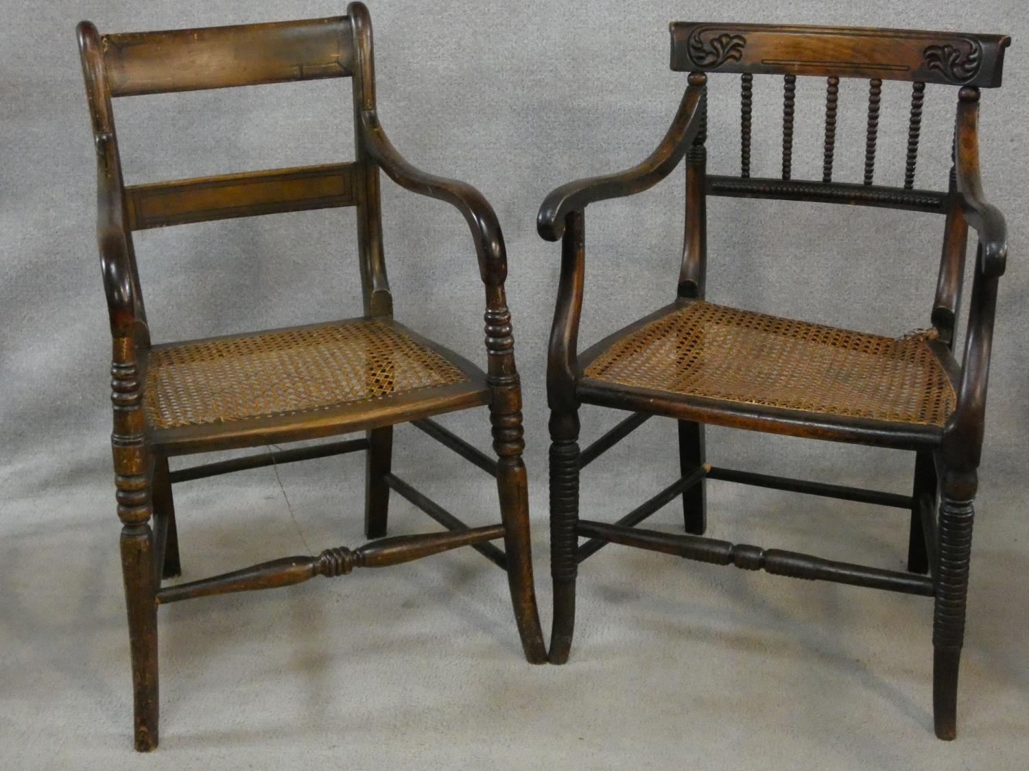 A Regency beech framed and painted caned seated armchair and a similar armchair (damaged as