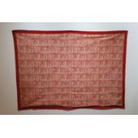 Hanging at Bismillah North Africa. Cotton textile with reserve decoration on a red background of the