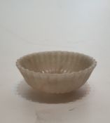 A Mughal carved agate bowl in the form of a lotus flower, with a gadrooned design. D11.5cm.