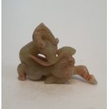 A Chinese carved jade deer and foliage figure. L.9.5xW.7cm