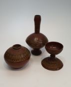 Three Turkish Tophane red pottery vessels, to include a footed vase with elongated neck with