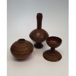 Three Turkish Tophane red pottery vessels, to include a footed vase with elongated neck with