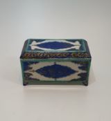 A 19th century Turkish style ceramic blue and green under glazed lidded box. With bold geometric