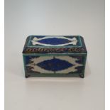 A 19th century Turkish style ceramic blue and green under glazed lidded box. With bold geometric