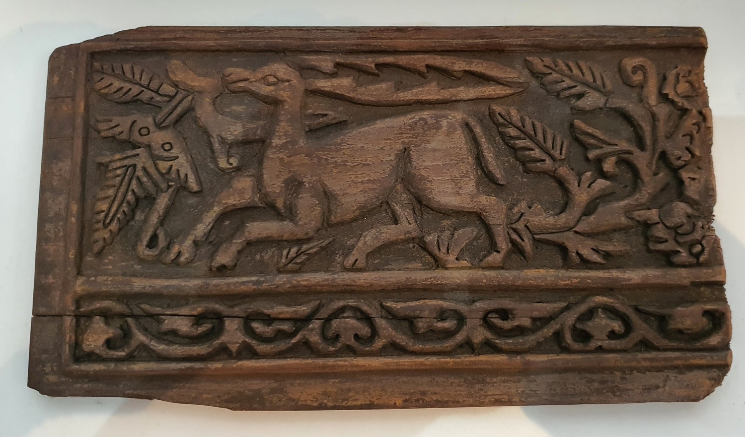A Fatimid Islamic carved wooden plaque, depicting a stylized deer among foliage with a scrolling - Image 2 of 3